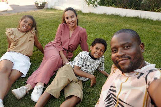 A joyful multiracial family enjoying time together in a sunny garden.